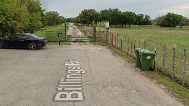 Behind the La Cantera neighborhood gate, shown in an image from Google Streetview, there is a portion of Billings Road that has been maintained by Tarrant County since 2008. Commissioners may decide to disown the tract at their April 15, 2026 meeting. Behind the La Cantera neighborhood gate, shown in an image from Google Streetview, there is a portion of Billings Road that has been maintained by Tarrant County since 2008. Commissioners may decide to disown the tract at their April 15, 2026 meeting.